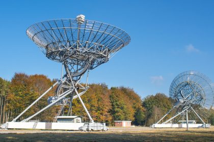 A photo of two big radio antennas.